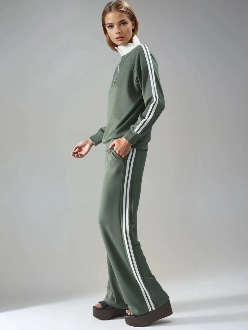 هيكاب طقم نسائي قطعتين مخطط بأرجل واسعة وياقة بسحاب من مجموعة بيرسان